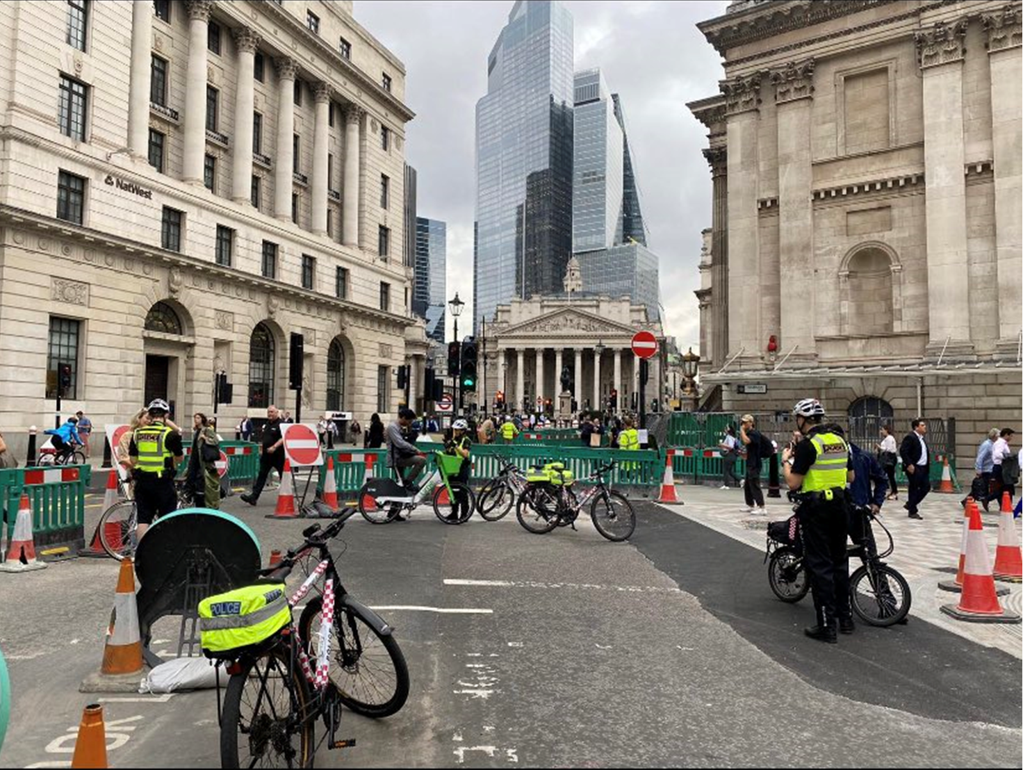 Police officers from the Cycle Team speak to members of the public at Bank Junction