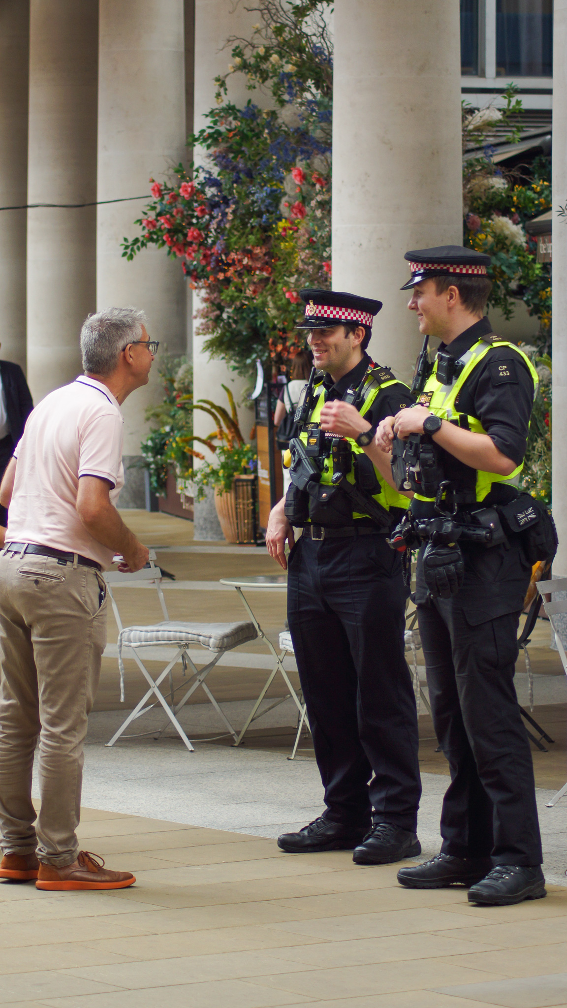 Man speaking to police officers